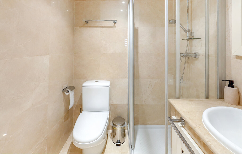 Bathroom with bath and shower